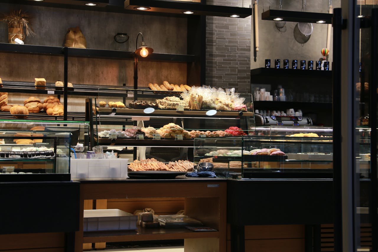 services-04 Inviting bakery interior showcasing a variety of fresh breads and pastries on display in a warm setting.